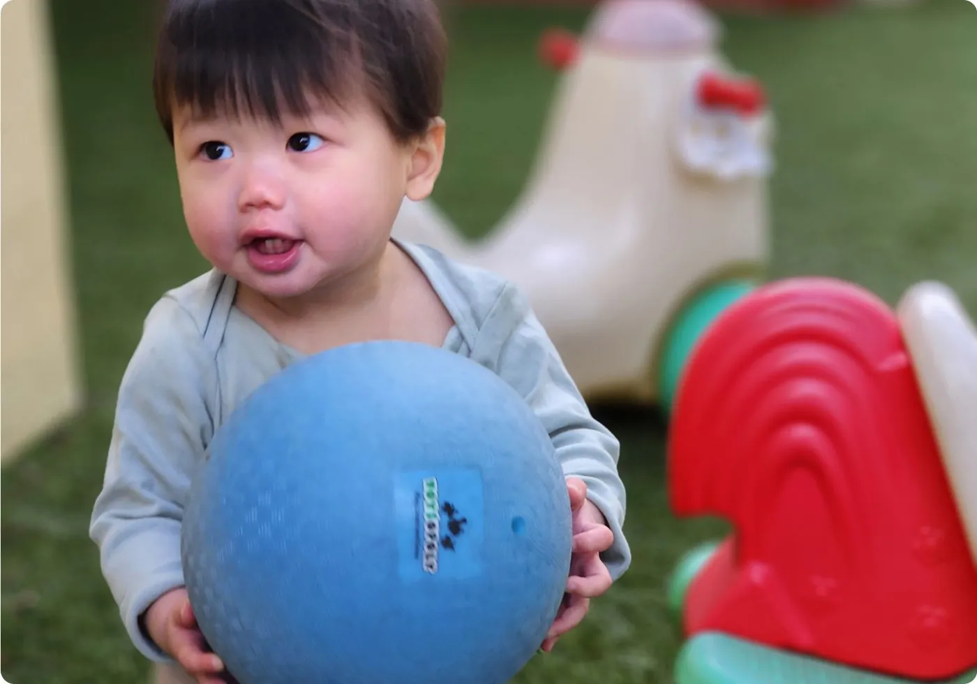 Toddler exploring at Arcadia Preschool Montessori Academy